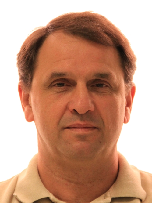 Head shot of male with short hair.