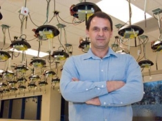 Ivan Seskar standing in a engineering laboratory